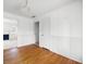 View of dining room with hardwood floors, white paneled walls, and access to living room at 2251 Trailwood Se Dr, Smyrna, GA 30080