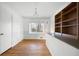 Dining area featuring hardwood floors, white wood paneling, and open shelving at 2251 Trailwood Se Dr, Smyrna, GA 30080