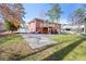 Exterior showcasing a fenced yard, patio, and a well-maintained lawn surrounding the brick house at 2251 Trailwood Se Dr, Smyrna, GA 30080