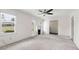 Comfortable living room featuring carpeted floors, multiple windows, and a sleek fireplace at 2251 Trailwood Se Dr, Smyrna, GA 30080
