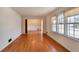 Sunlit living room with large windows and hardwood flooring at 2297 Hylaea Rd, Tucker, GA 30084