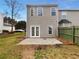Spacious backyard featuring a patio, green lawn, and privacy fence, perfect for outdoor activities at 45 Hampton Dr, Cartersville, GA 30121