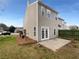 The two-story home has a quaint backyard with a small patio and newly trimmed trees at 45 Hampton Dr, Cartersville, GA 30121