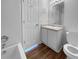 A well-lit bathroom featuring a toilet, mirror, vanity and shower-tub combination is move-in ready at 45 Hampton Dr, Cartersville, GA 30121