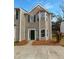 Charming two-story home features a classic design with neutral siding and well-maintained landscaping in the front at 45 Hampton Dr, Cartersville, GA 30121