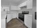 Modern kitchen with stainless steel appliances, white cabinetry, and sleek countertops at 45 Hampton Dr, Cartersville, GA 30121