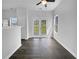 Open-plan living room with hardwood floors, natural light, and direct access to the backyard at 45 Hampton Dr, Cartersville, GA 30121