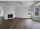 Bright and airy living room features a fireplace, gleaming hardwood floors, and natural light at 45 Hampton Dr, Cartersville, GA 30121