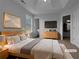 Serene main bedroom boasts a comfortable bed, stylish furnishings, and ample closet space at 45 Hampton Dr, Cartersville, GA 30121