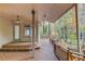Expansive covered back deck with wooden railing and fan perfect for enjoying outdoors at 1667 Manhasset Farm Ct, Atlanta, GA 30338