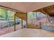 Back deck featuring spiral staircase leading to wooded yard and stream at 1667 Manhasset Farm Ct, Atlanta, GA 30338
