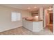 Basement bar features counter top, neutral walls and carpet, and wood shelving at 1667 Manhasset Farm Ct, Atlanta, GA 30338