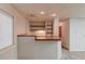Cozy basement bar area with wood shelving and sink offers an ideal entertainment space at 1667 Manhasset Farm Ct, Atlanta, GA 30338