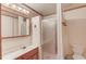 Bathroom featuring a shower, commode, vanity, medicine cabinet, and neutral walls at 1667 Manhasset Farm Ct, Atlanta, GA 30338