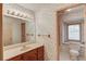 Patterned bathroom featuring a large vanity mirror at 1667 Manhasset Farm Ct, Atlanta, GA 30338