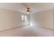 Bright bedroom with a window and neutral carpet at 1667 Manhasset Farm Ct, Atlanta, GA 30338