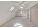 Bright and spacious carpeted room featuring a skylight and multiple closets at 1667 Manhasset Farm Ct, Atlanta, GA 30338