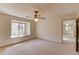 Bright, neutral carpeted bedroom with a window at 1667 Manhasset Farm Ct, Atlanta, GA 30338