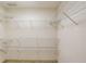 Walk-in closet with wire shelving and neutral carpet at 1667 Manhasset Farm Ct, Atlanta, GA 30338