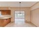Open-concept kitchen with tile floors and a view of sunroom at 1667 Manhasset Farm Ct, Atlanta, GA 30338