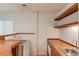 Basement kitchenette area features an electric range, wood countertops, a sink, and wood shelving at 1667 Manhasset Farm Ct, Atlanta, GA 30338