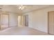 Spacious bedroom featuring a ceiling fan, ample natural light, and neutral carpet at 1667 Manhasset Farm Ct, Atlanta, GA 30338