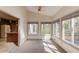 Bright sunroom with large windows offering scenic views and abundant natural light at 1667 Manhasset Farm Ct, Atlanta, GA 30338