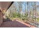 Paver patio with iron railing, lush landscaping and mature trees providing excellent privacy at 407 North Ave, Atlanta, GA 30354