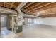 Unfinished basement with exposed ceiling and utility connections at 407 North Ave, Atlanta, GA 30354