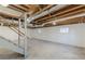 Unfinished basement shows exposed ceiling and natural light at 407 North Ave, Atlanta, GA 30354