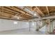 Unfinished basement with exposed ceiling and lighting at 407 North Ave, Atlanta, GA 30354