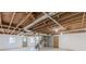 Unfinished basement with exposed ceiling and walkout access at 407 North Ave, Atlanta, GA 30354