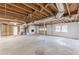 Unfinished basement with exposed ceiling and garage access at 407 North Ave, Atlanta, GA 30354
