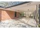 Large brick carport featuring concrete floor and metal supports with direct access to house at 407 North Ave, Atlanta, GA 30354