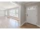 Inviting foyer with hardwood floors and natural light from the sidelight window at 407 North Ave, Atlanta, GA 30354