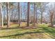 Traditional ranch-style home featuring a well-maintained lawn, classic brick facade, and mature trees at 407 North Ave, Atlanta, GA 30354