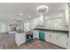 Open kitchen showcases white cabinets and blue appliances at 407 North Ave, Atlanta, GA 30354