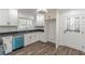 Charming kitchen with white cabinets and a blue dishwasher at 407 North Ave, Atlanta, GA 30354