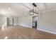Open living room with hardwood floors adjacent to the kitchen area at 407 North Ave, Atlanta, GA 30354