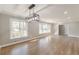 Spacious living room with hardwood floors and natural light from the many windows at 407 North Ave, Atlanta, GA 30354