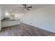 Open-concept living room featuring wood floors and white wainscoting at 407 North Ave, Atlanta, GA 30354