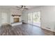 Living area boasts a fireplace and sliding glass doors to the outside at 407 North Ave, Atlanta, GA 30354