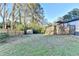 Expansive backyard with a wooden deck and gazebo, plus a charming storage shed and privacy fence at 4087 Signal Rdg, Lilburn, GA 30047