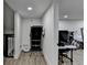 Basement area has modern flooring, a small treadmill, and a table with computer and desk at 4087 Signal Rdg, Lilburn, GA 30047