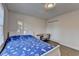 Cozy bedroom with wood floors features a closet, desk, and natural light at 4087 Signal Rdg, Lilburn, GA 30047