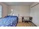Comfortable bedroom with wood floors features a closet, desk, and natural light at 4087 Signal Rdg, Lilburn, GA 30047