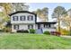 Charming home with a covered porch, manicured landscaping, and a fresh exterior paint scheme at 4087 Signal Rdg, Lilburn, GA 30047