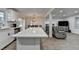 Updated kitchen island overlooks the breakfast nook and adjacent living room, perfect for entertaining at 4087 Signal Rdg, Lilburn, GA 30047