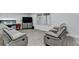 Bright and airy living room with comfortable seating, a large window, and clean, modern finishes at 4087 Signal Rdg, Lilburn, GA 30047