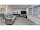Spacious living room with a comfortable gray sofa, modern lighting, and sleek flooring at 4087 Signal Rdg, Lilburn, GA 30047